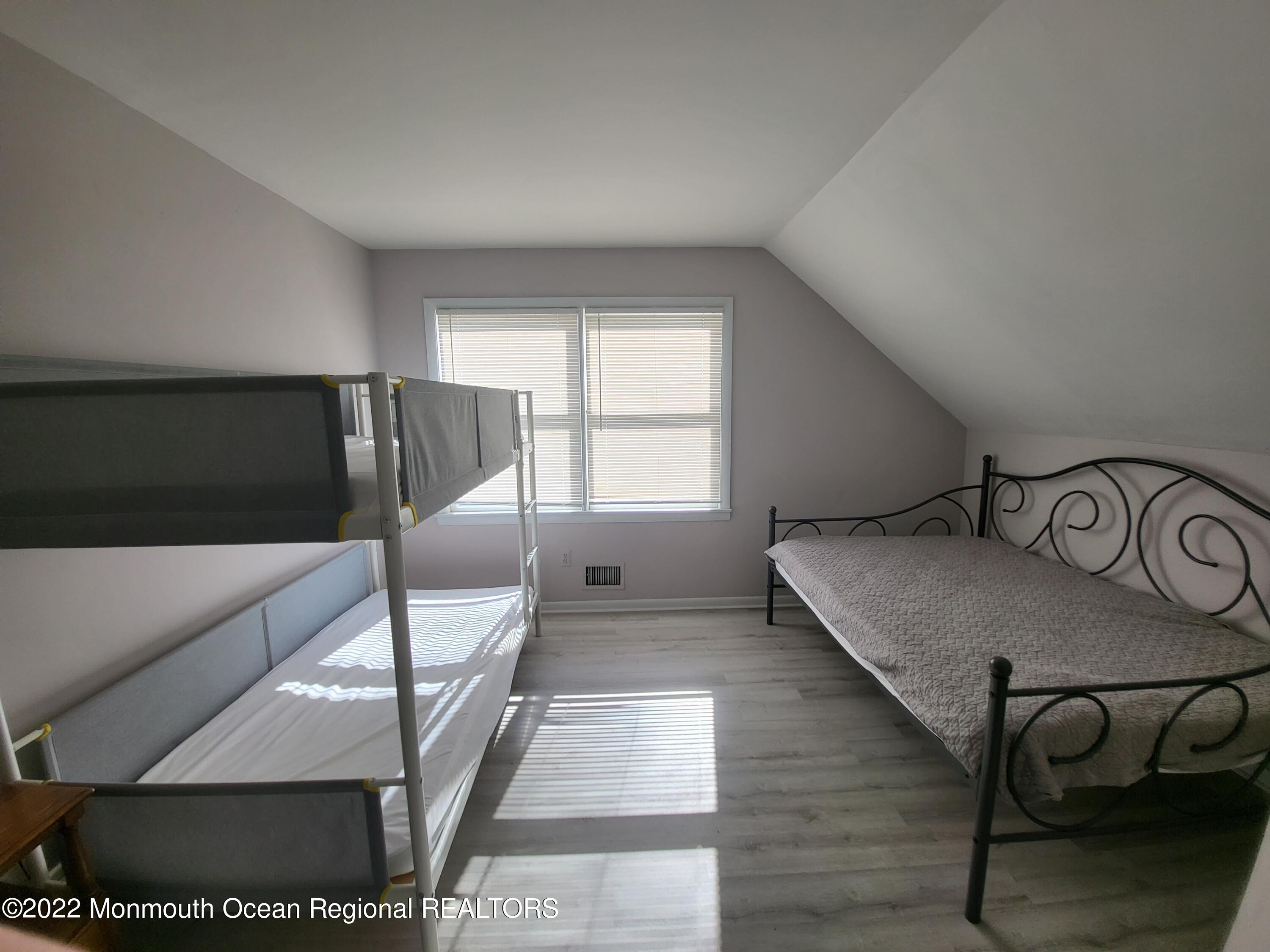 1703 A Street, Unit REAR Belmar, NJ 07719 - Photo 15 of 29 a view of a livingroom with furniture and window
