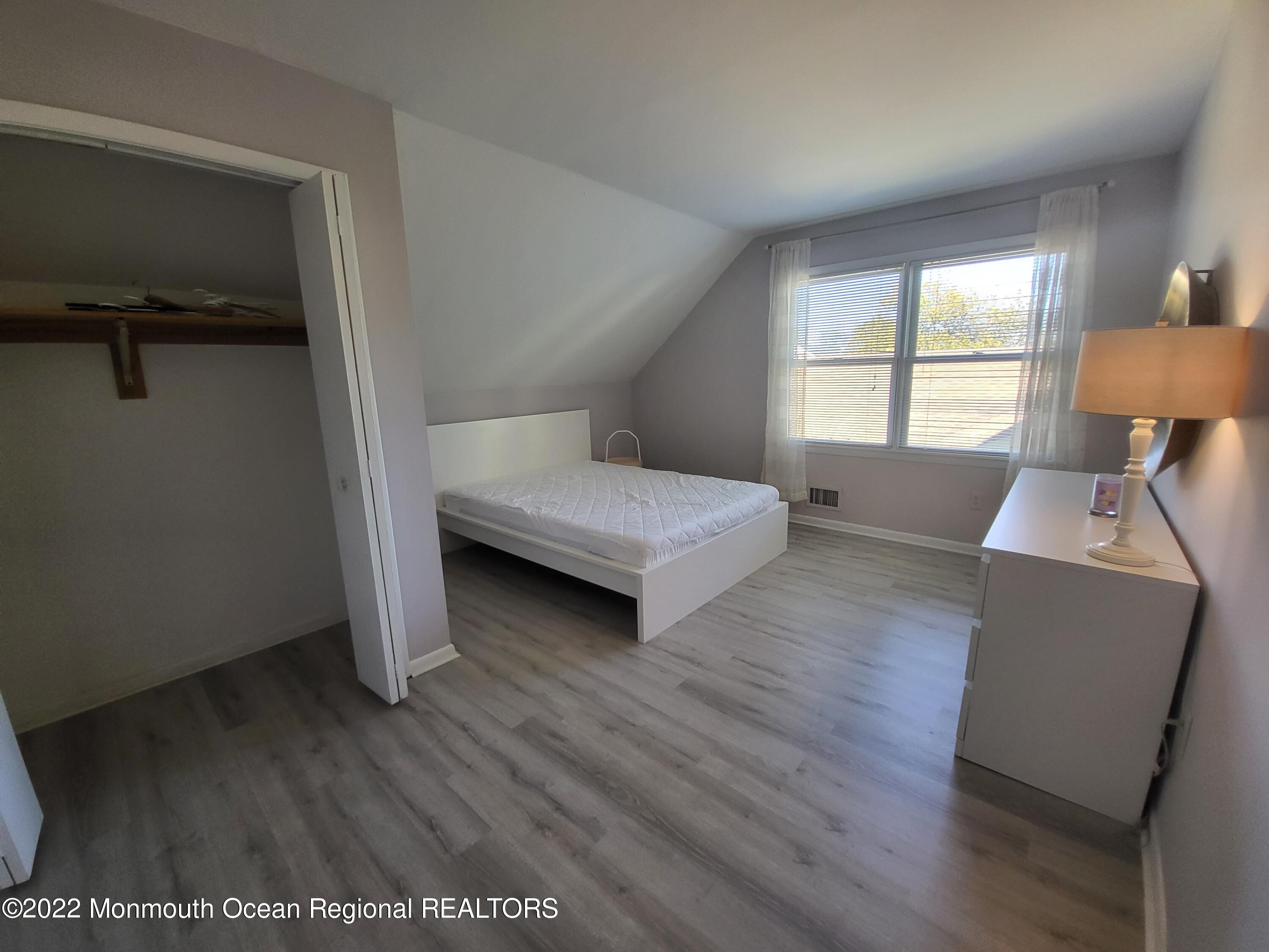 1703 A Street, Unit REAR Belmar, NJ 07719 - Photo 22 of 29 a living room with furniture and a window