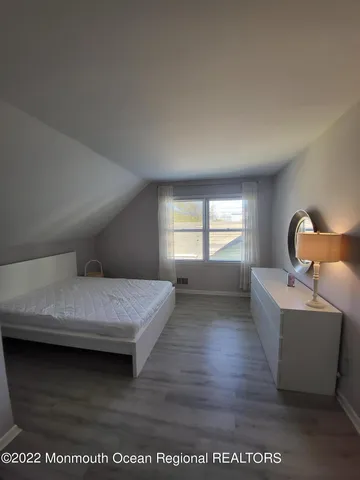 a bedroom with furniture and window