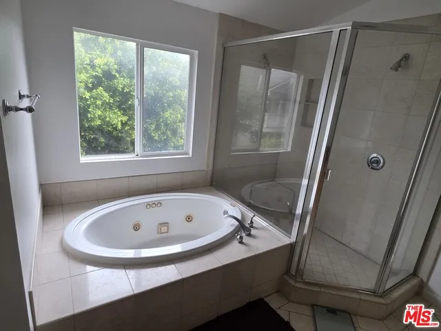 a bathroom with a tub and sink