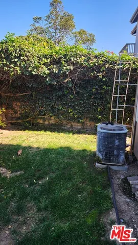 a view of a swimming pool with an outdoor space and seating area