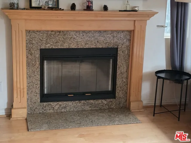 a living room with a fireplace and a table