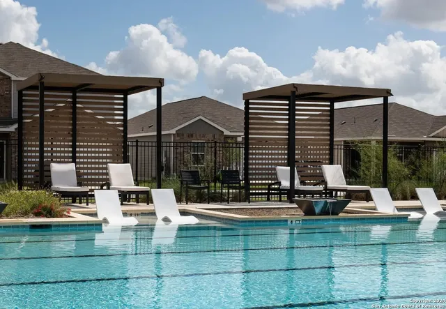 a view of house with outdoor seating space