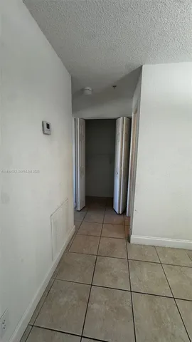 a view of a utility room with closet