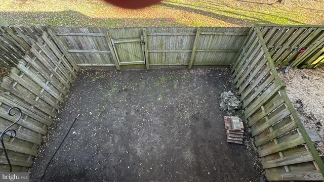 a view of outdoor space and wooden fence