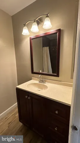 a bathroom with a shower and a sink