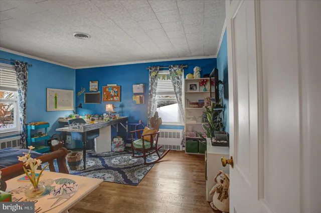 a bedroom with a bed and a table in it