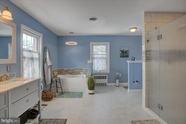 a bathroom with a bathtub and sink