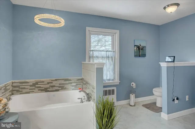 a room with a dresser and a mirror