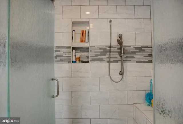 a kitchen with sink a stove and cabinets