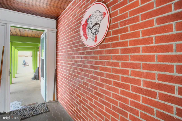 a view of a dining room with a table and chairs