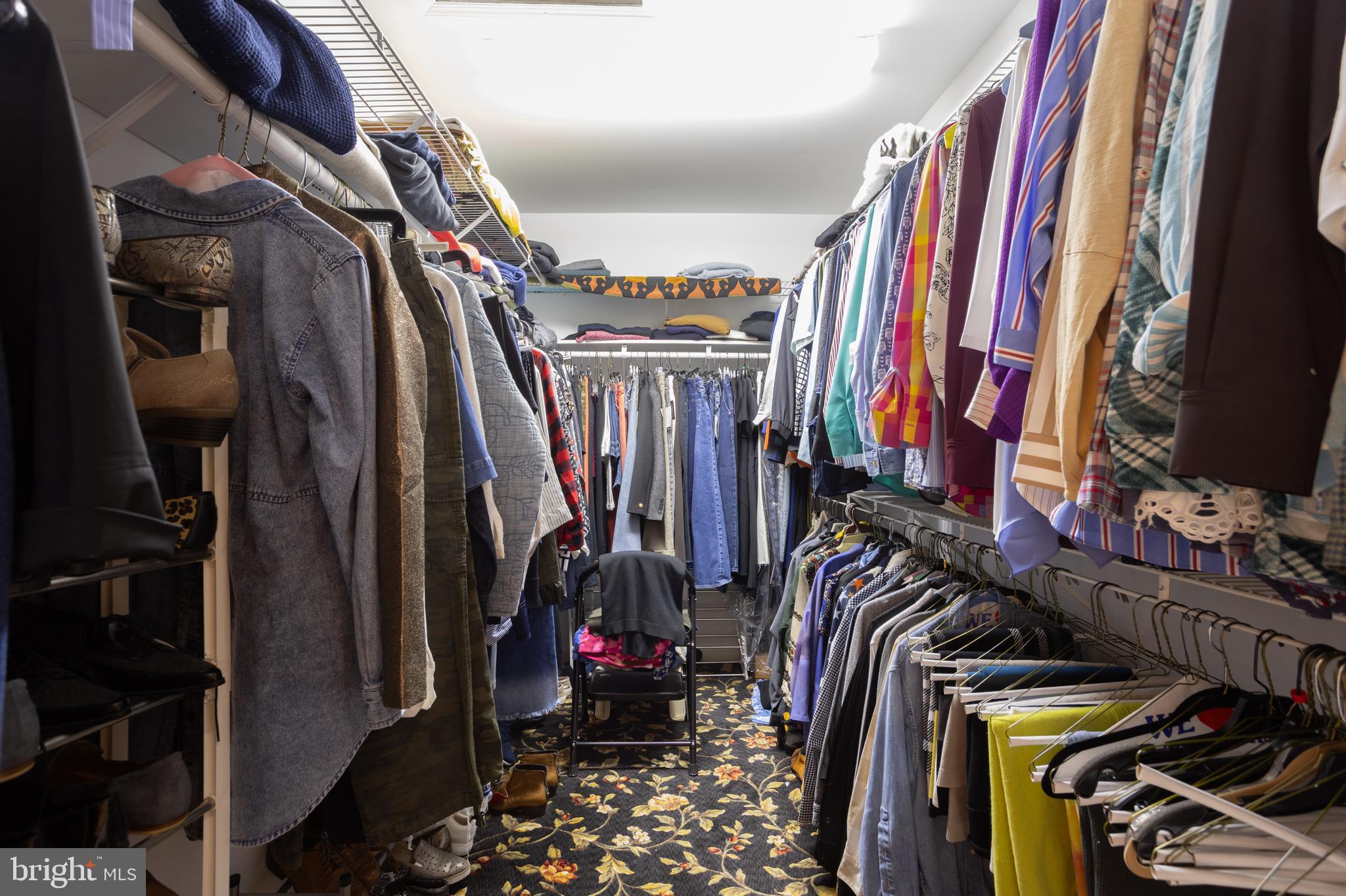 63 Raisin Tree Circle Baltimore, MD 21208 - Photo 32 of 57 a view of walk in closet with clothes and shoes