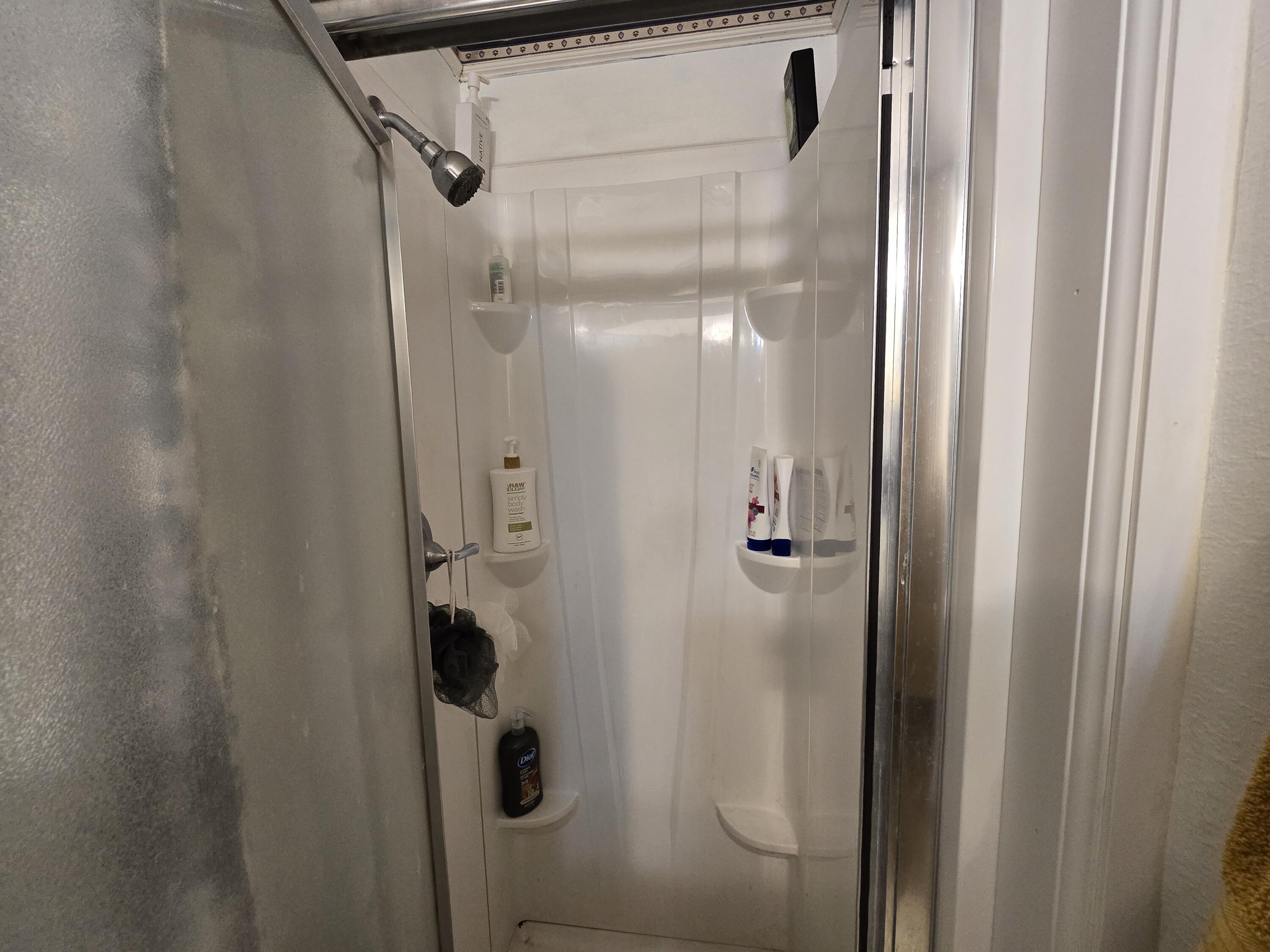 5806 12th Street Lubbock, TX 79416 - Photo 11 of 17 a bathroom with a shower