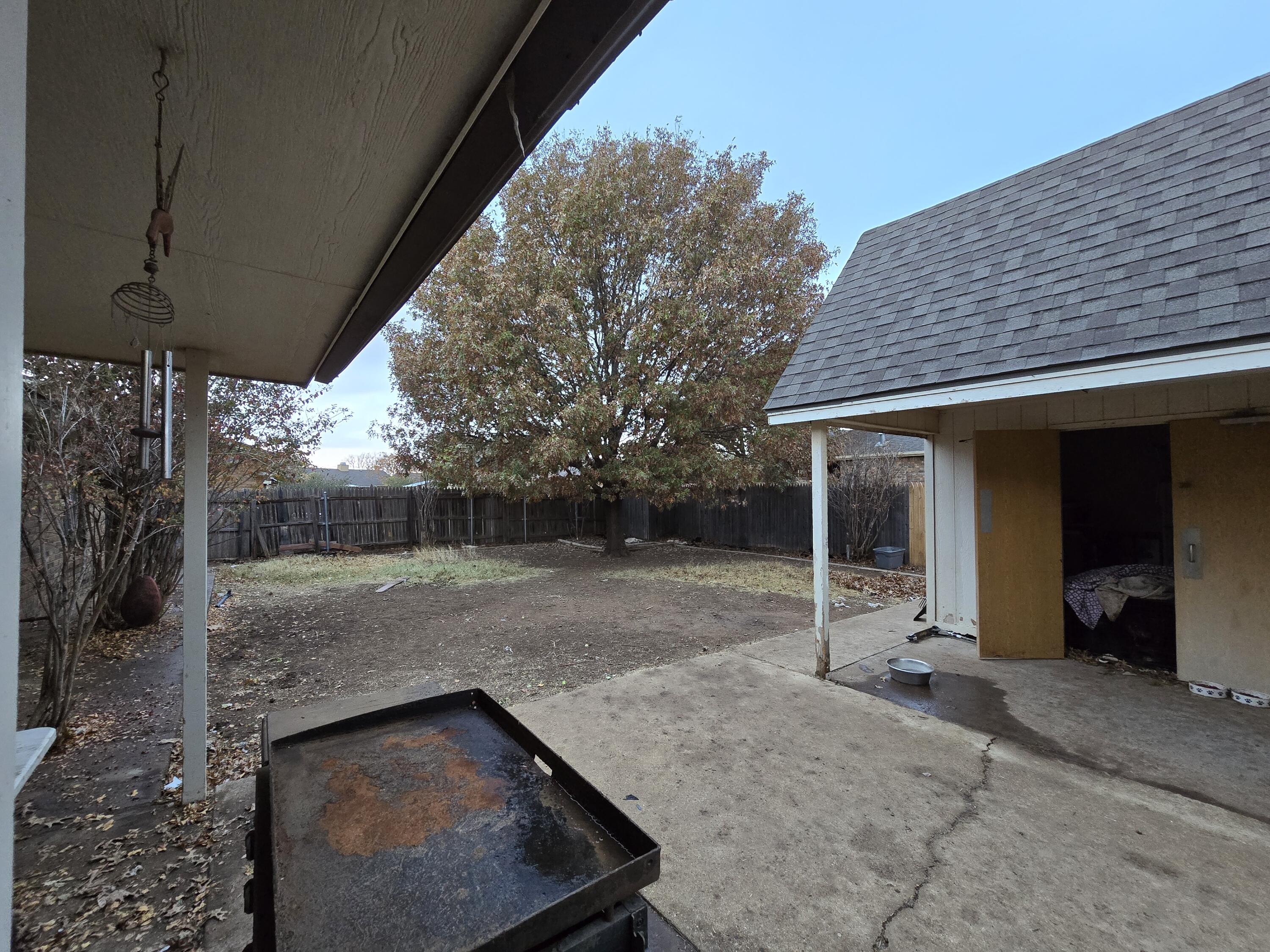 5806 12th Street Lubbock, TX 79416 - Photo 16 of 17 a view of a house with backyard and porch