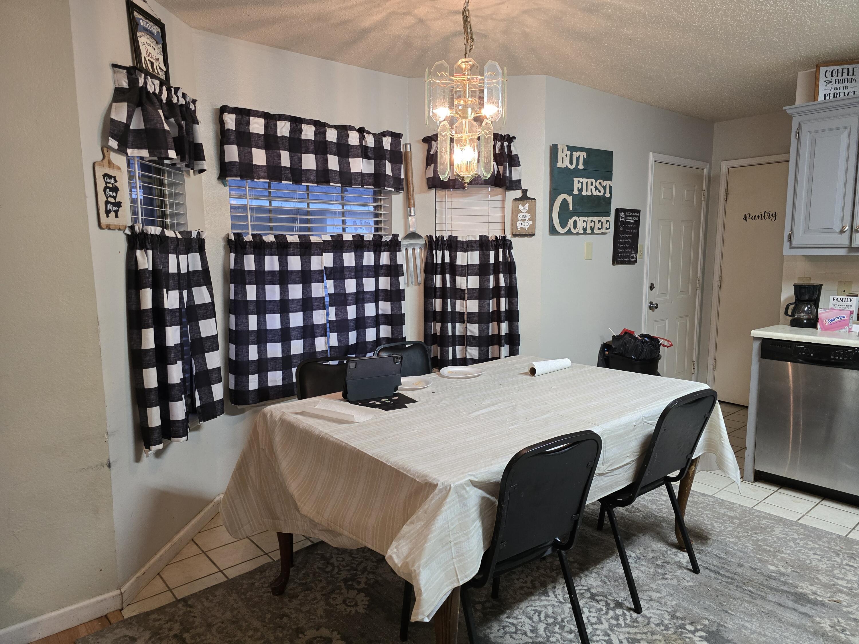 5806 12th Street Lubbock, TX 79416 - Photo 4 of 17 a close view of a dining table chairs and kitchen view