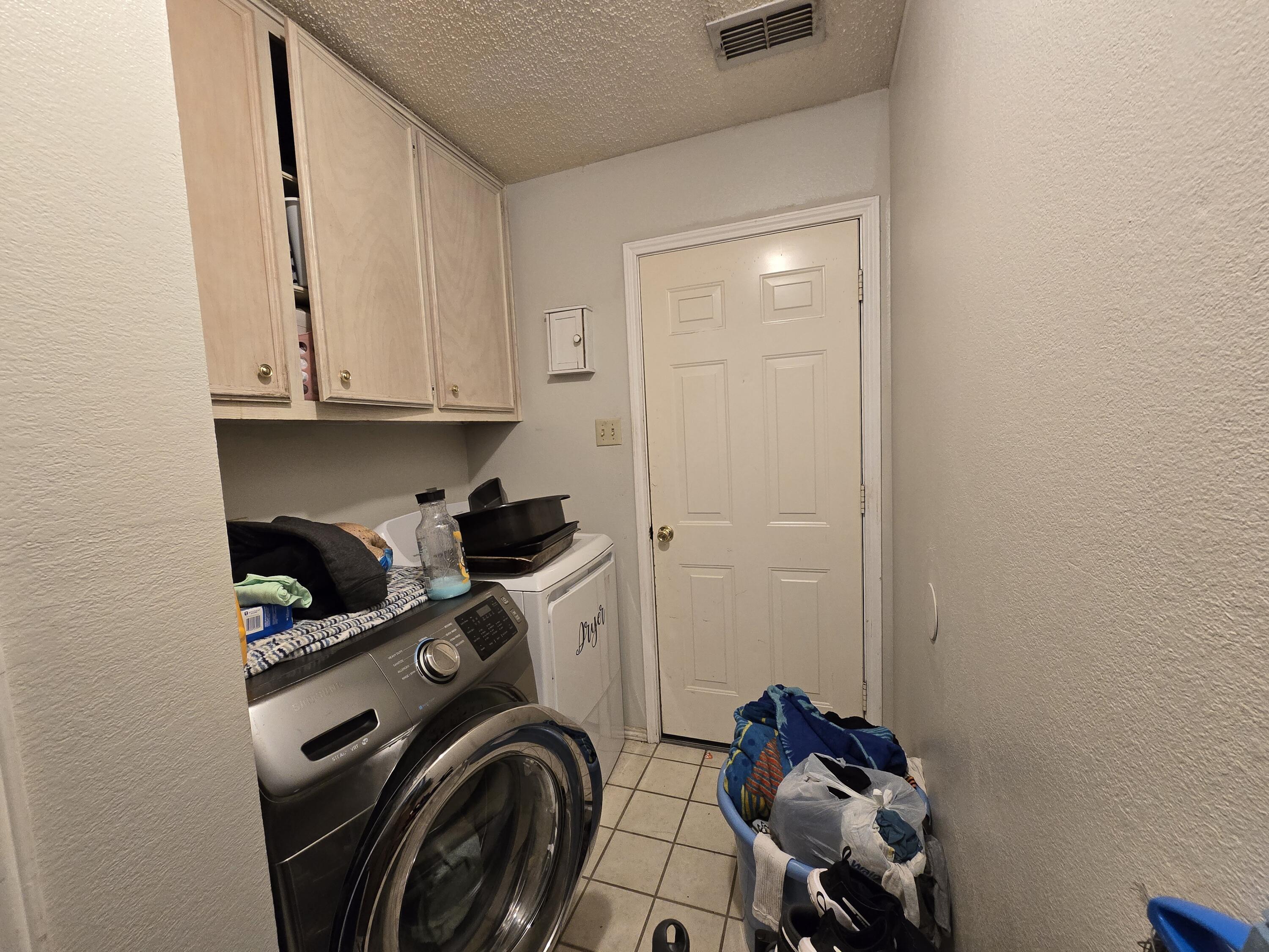 5806 12th Street Lubbock, TX 79416 - Photo 8 of 17 a view of walk in closet with clothes and shoes
