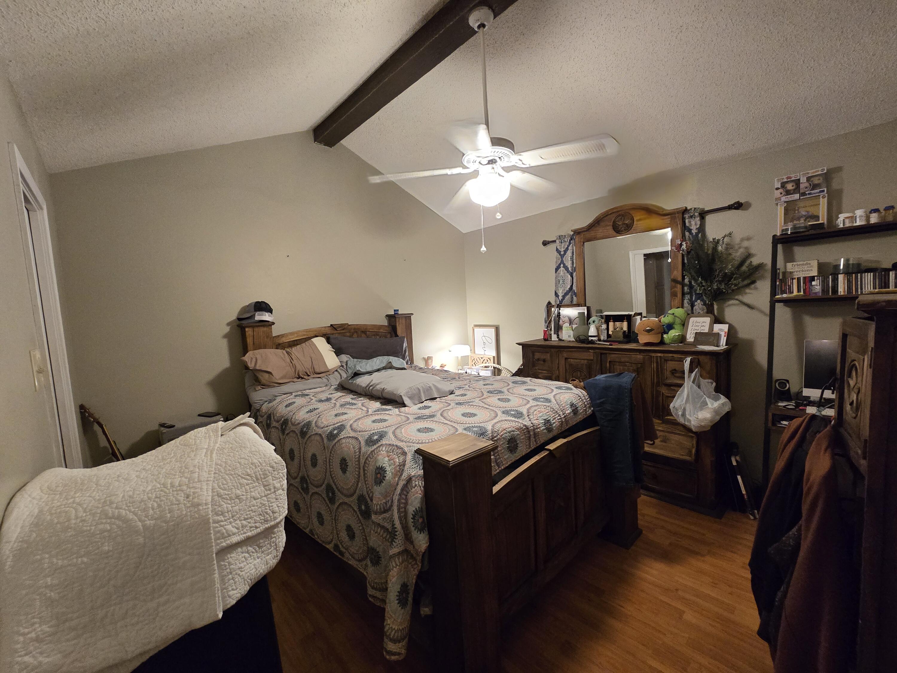 5806 12th Street Lubbock, TX 79416 - Photo 9 of 17 a kitchen with stainless steel appliances granite countertop a stove and a refrigerator