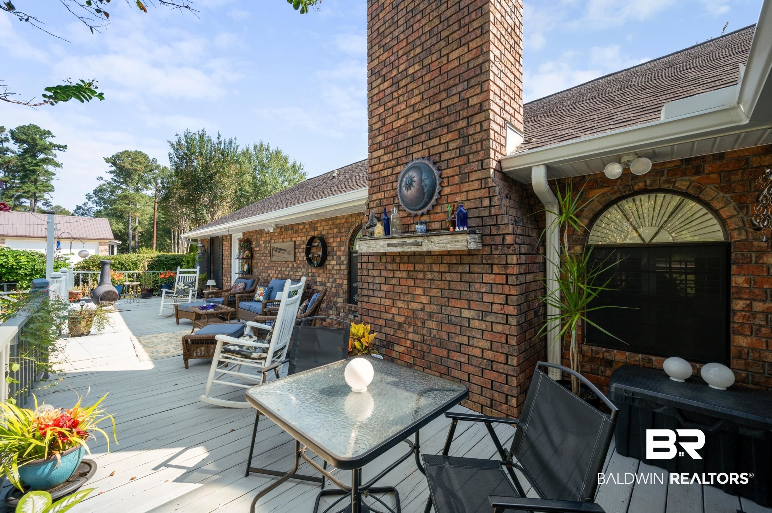 550 Norwood Road Monroeville, AL 36460 - Photo 32 of 46 Wooden deck with outdoor dining area