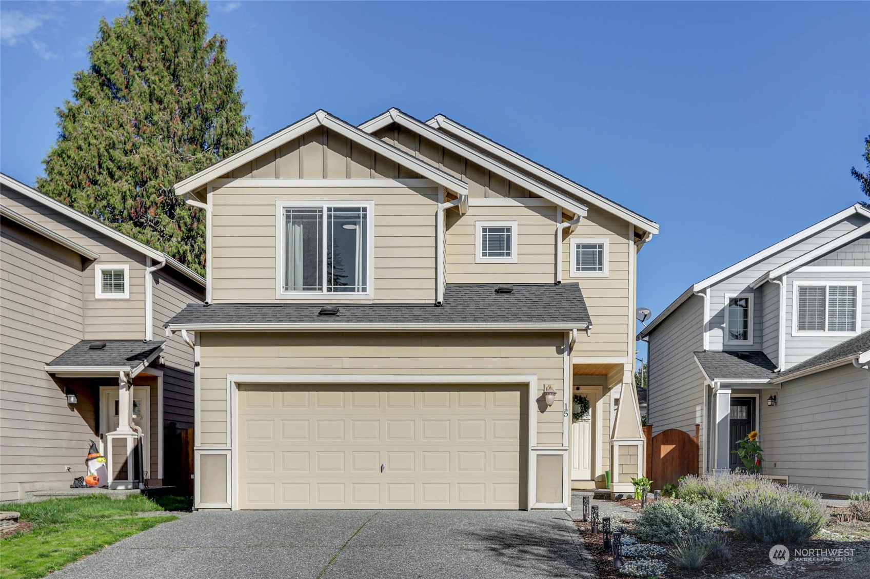 15 194th Street Southwest Bothell, WA 98012 - Photo 1 of 27 a front view of a house with garden