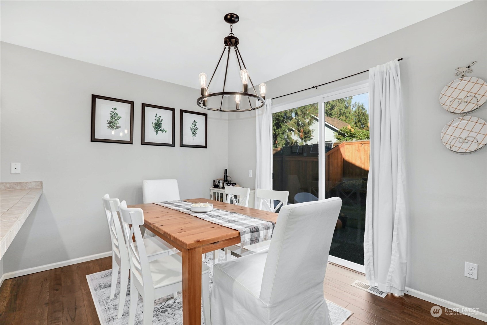 15 194th Street Southwest Bothell, WA 98012 - Photo 12 of 27 a view of a dining room with furniture window and wooden floor