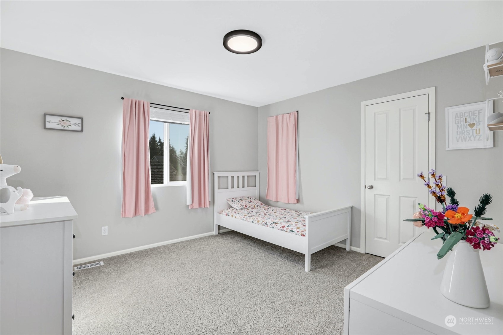 15 194th Street Southwest Bothell, WA 98012 - Photo 20 of 27 a bedroom with furniture and a potted plant
