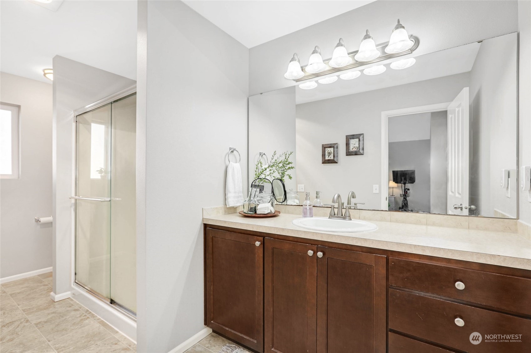 15 194th Street Southwest Bothell, WA 98012 - Photo 24 of 27 a bathroom with a double vanity sink and a mirror