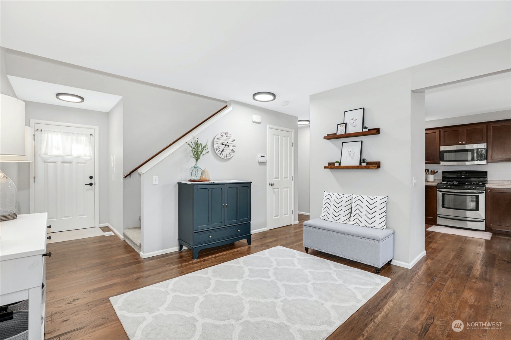 15 194th Street Southwest Bothell, WA 98012 - Photo 4 of 27 a spacious bedroom with a bed and cabinets