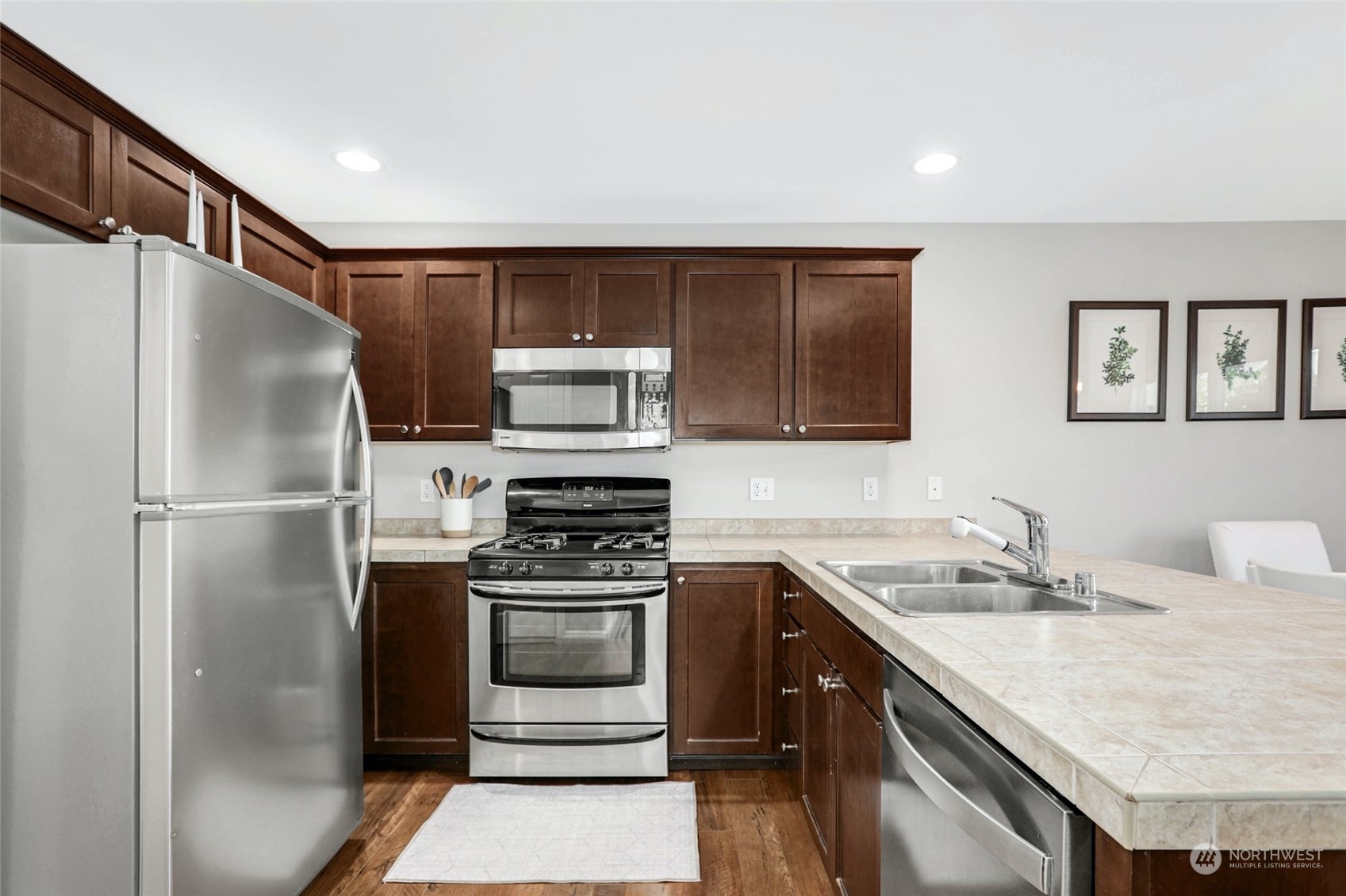 15 194th Street Southwest Bothell, WA 98012 - Photo 10 of 27 a kitchen with a sink stove and refrigerator