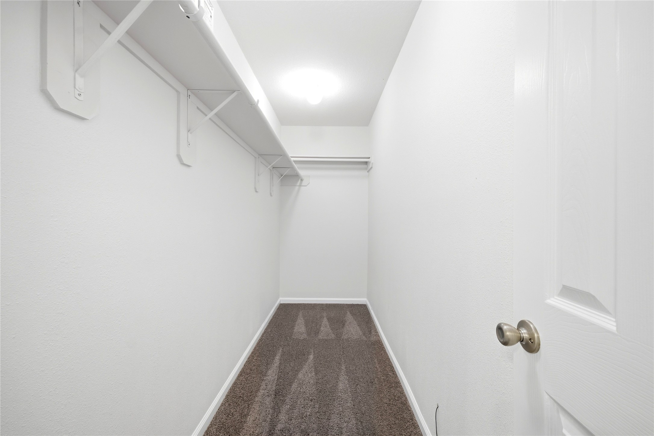 5411 Gate Canyon Court Spring, TX 77373 - Photo 30 of 33 a view of a hallway with wooden floor