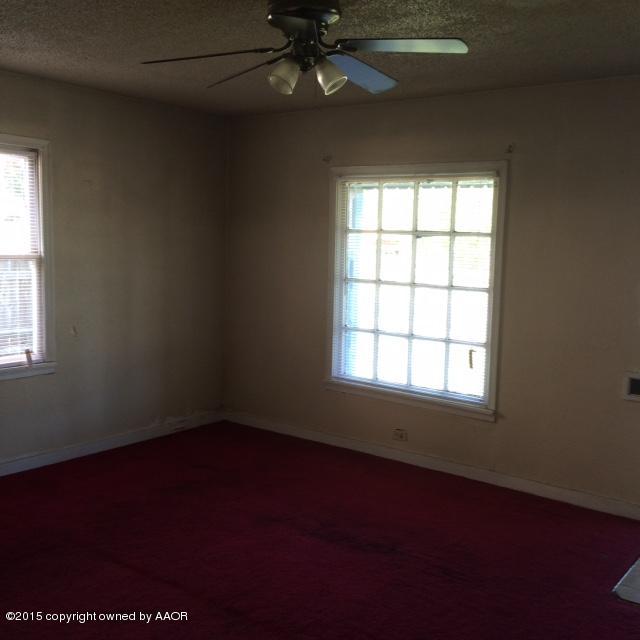 3704 South Harrison Street Amarillo, TX 79110 - Photo 5 of 13 an empty room with a window