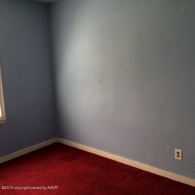 3704 South Harrison Street Amarillo, TX 79110 - Photo 7 of 13 a view of a small space with wooden floor and a window