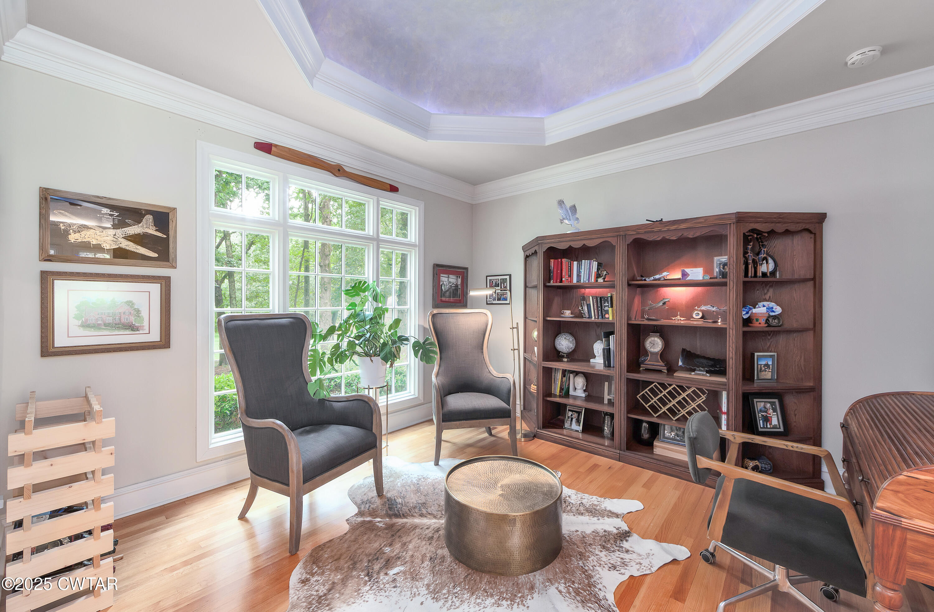 25 Whitfield Cove Jackson, TN 38305 - Photo 14 of 35 a living room with furniture a bookshelf and a window