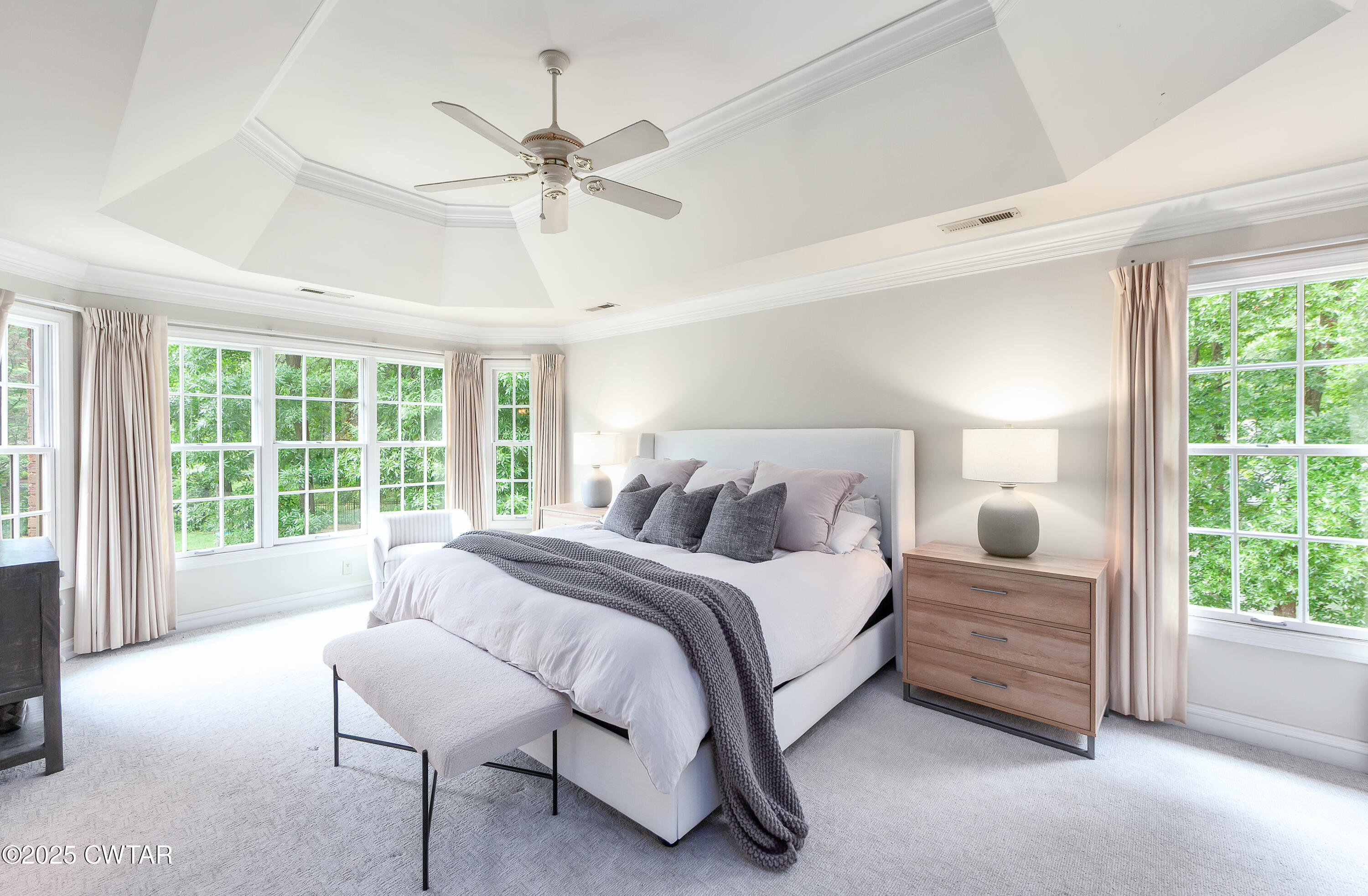 25 Whitfield Cove Jackson, TN 38305 - Photo 21 of 35 a bedroom with a large bed and a large window