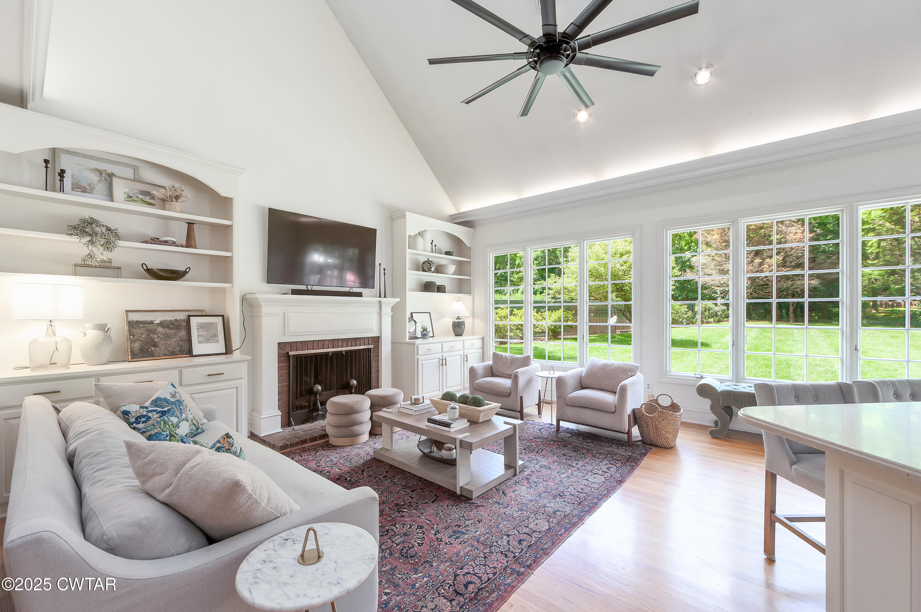 25 Whitfield Cove Jackson, TN 38305 - Photo 8 of 35 a living room with furniture fireplace and a large window