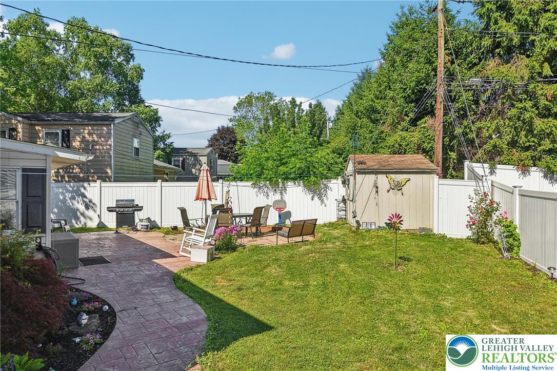 2649 Nottingham Road Bethlehem, PA 18017 - Photo 32 of 49 A well-maintained yard offers a spacious patio ideal for outdoor relaxation and entertaining.