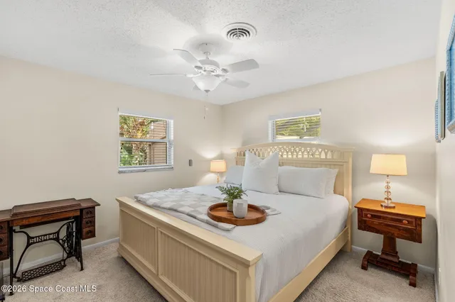 a bedroom with a bed and a table in it