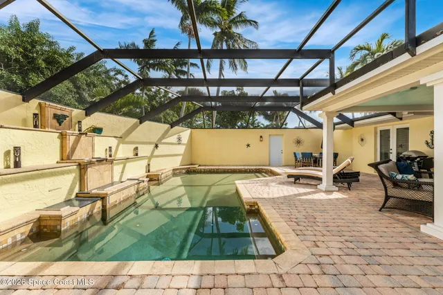 a view of a patio with table and chairs and potted plants