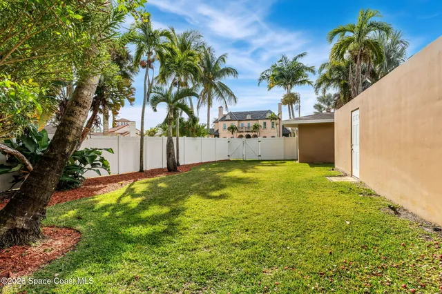 a view of a swimming pool with a yard