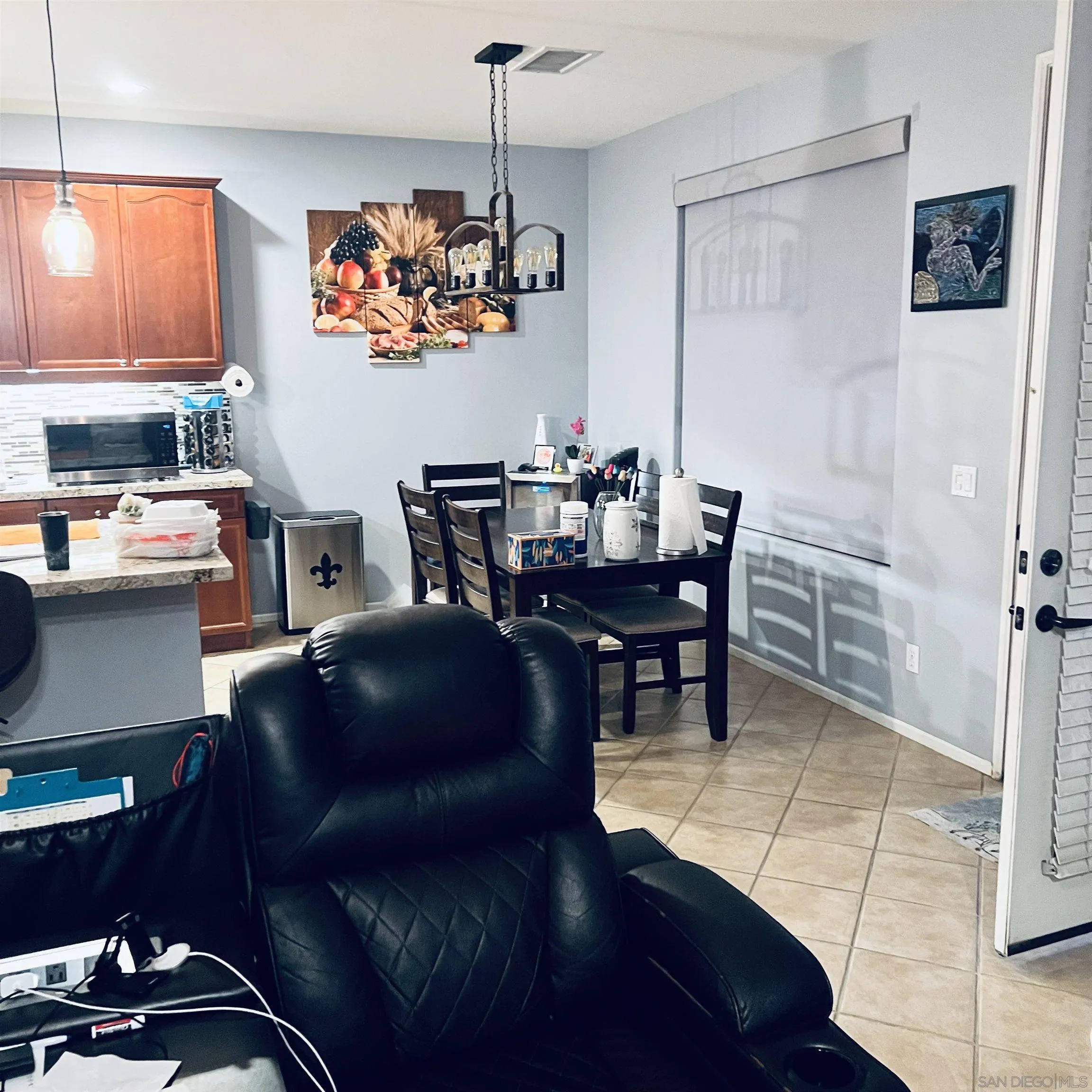 44482 Avenida Suarez Indio, CA 92201 - Photo 11 of 12 a view of a dining room with furniture and chandelier