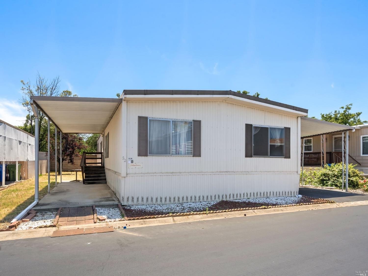 4603 Balfour Road, Unit 52 Brentwood, CA 94513 - Photo 1 of 1 a front view of a house with a yard
