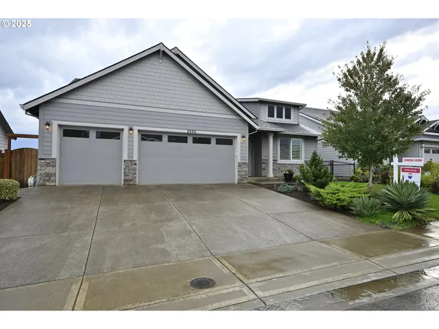 a view of garage yard and tree