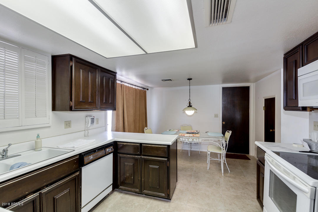 36 East Piping Rock Road Phoenix, AZ 85022 - Photo 12 of 39 Kitchen and Causal Dining