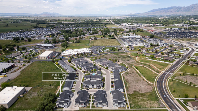 2483 South 1296th Street West Logan, UT 84321 - Photo 44 of 45 Aerial overview showcasing a developed community with a mix of residential structures and commercial buildings