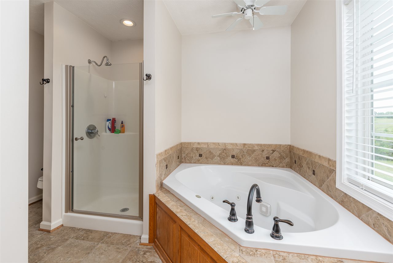 295 Todd Road Mount Sidney, VA 24467 - Photo 28 of 50 a bathroom with a tub and a shower
