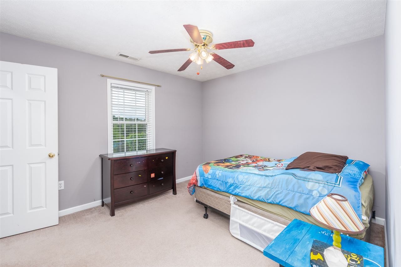 295 Todd Road Mount Sidney, VA 24467 - Photo 35 of 50 a bedroom with a bed and a chandelier