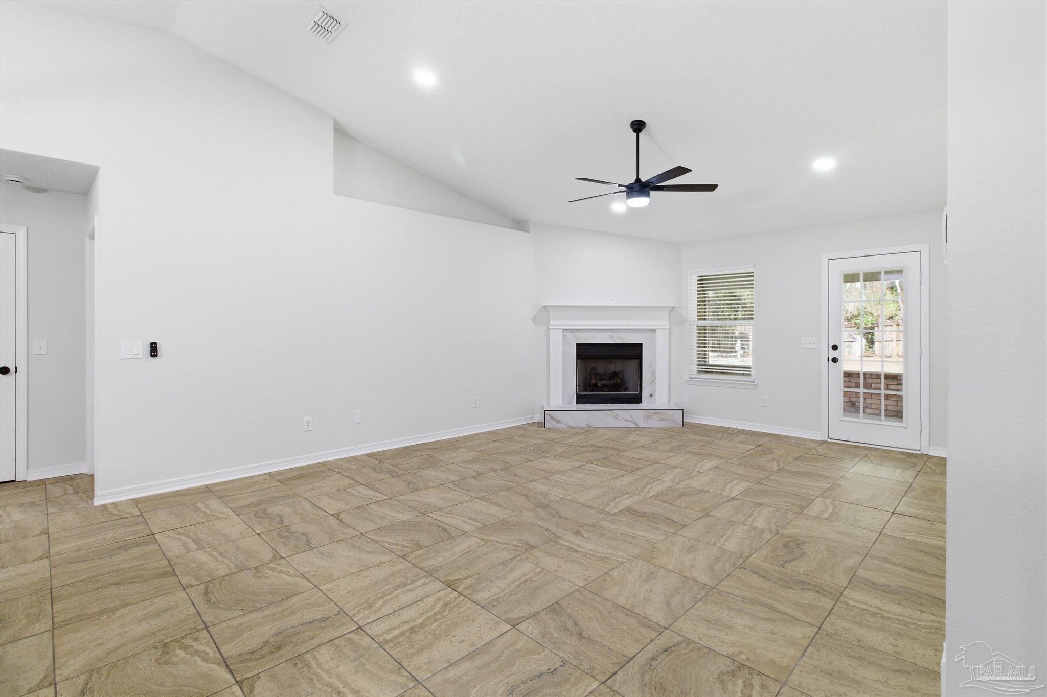 1866 Wareham Way Cantonment, FL 32533 - Photo 12 of 33 an empty room with fan and windows