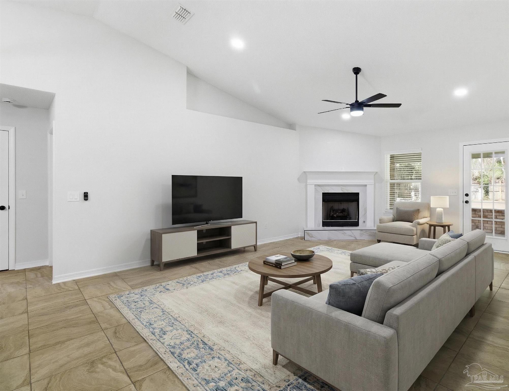 1866 Wareham Way Cantonment, FL 32533 - Photo 15 of 33 a living room with furniture and a flat screen tv