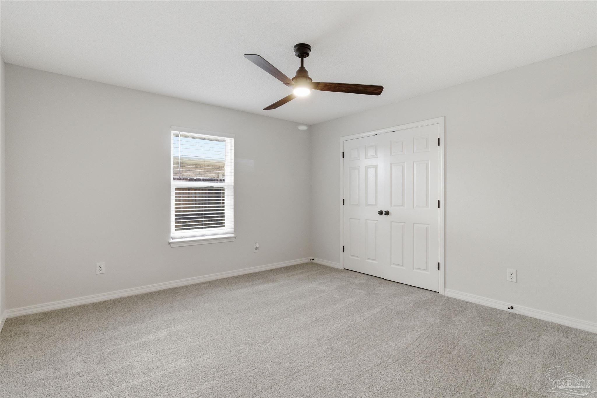 1866 Wareham Way Cantonment, FL 32533 - Photo 25 of 33 a view of an empty room with a window