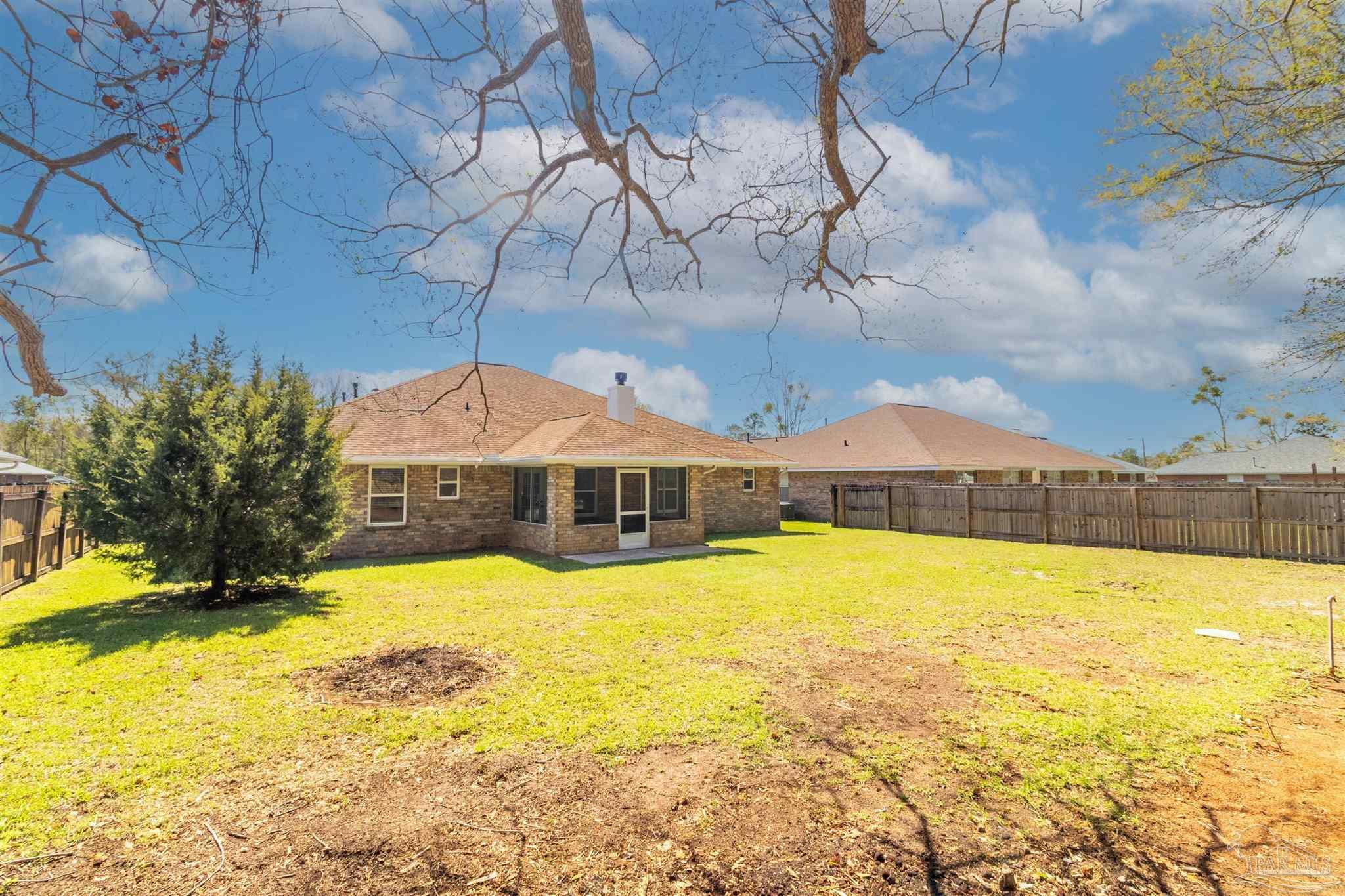 1866 Wareham Way Cantonment, FL 32533 - Photo 33 of 33 a view of a house with a yard and swimming pool
