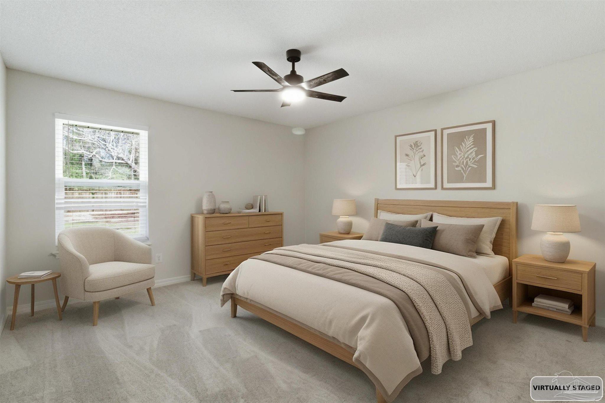 1866 Wareham Way Cantonment, FL 32533 - Photo 5 of 33 a bedroom with a bed and a couch